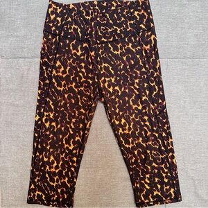 Fabletics PureLuxe Black and Orange Leggings with Bold Leopard Print